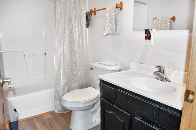 full bathroom with vanity, hardwood / wood-style floors, shower / bath combination with curtain, and toilet