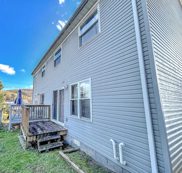 rear view of property with a deck