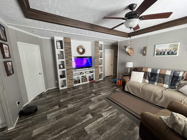 living room featuring a textured ceiling, ornamental molding, dark wood-style floors, and a ceiling fan