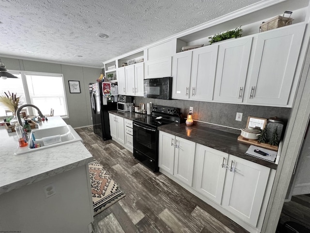 kitchen with dark wood-style floors, open shelves, white cabinets, a sink, and black appliances