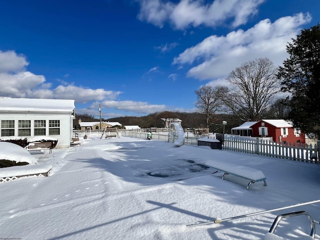 view of yard layered in snow