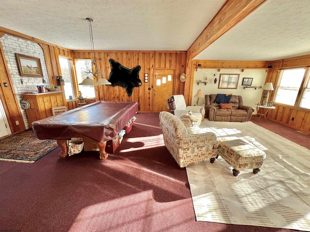 playroom with wooden walls, a textured ceiling, billiards, and carpet floors