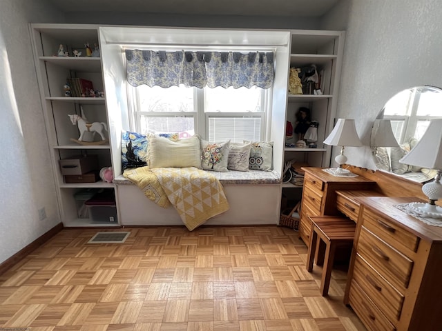 living area featuring light parquet flooring