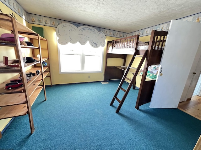 carpeted bedroom with a textured ceiling