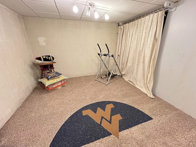 recreation room featuring a paneled ceiling