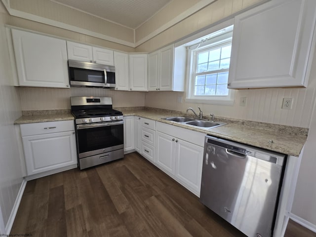 kitchen with sink, white cabinets, and stainless steel appliances