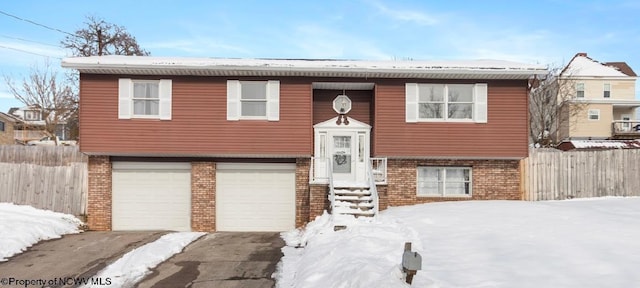 split foyer home featuring a garage