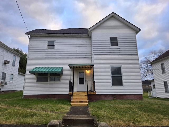 front facade with a front yard