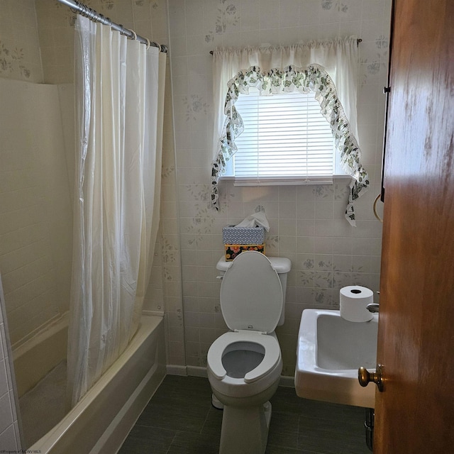 bathroom featuring toilet, tile walls, shower / bathtub combination with curtain, and tile patterned flooring