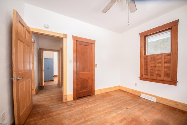 unfurnished bedroom with wood-type flooring and ceiling fan