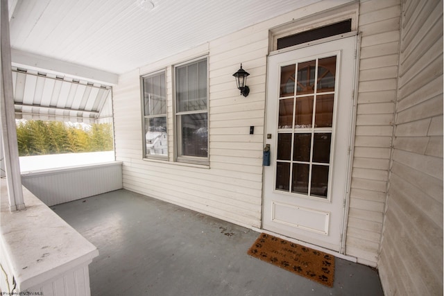 entrance to property with covered porch