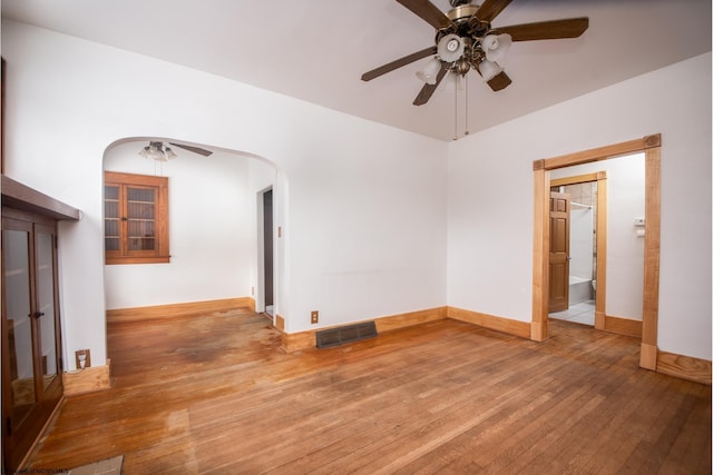 unfurnished room with ceiling fan and light wood-type flooring