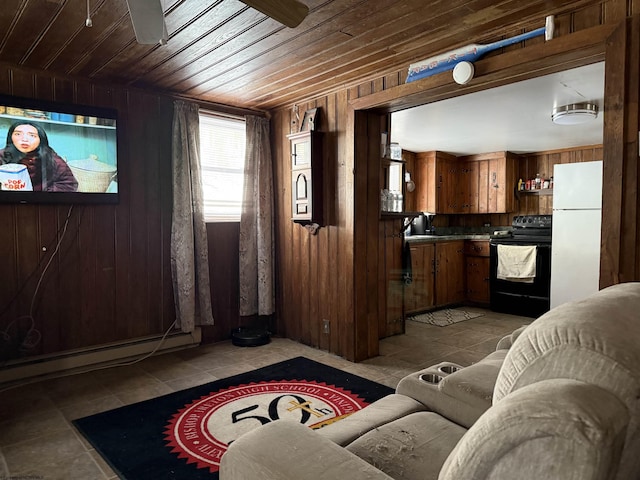 tiled living room with a baseboard radiator, wooden ceiling, ceiling fan, and wood walls