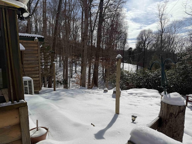 yard layered in snow with cooling unit