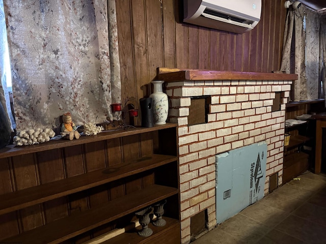 room details featuring an AC wall unit and wood walls