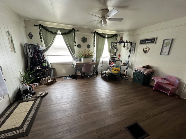 interior space with dark hardwood / wood-style flooring and ceiling fan