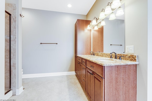 bathroom featuring vanity and an enclosed shower