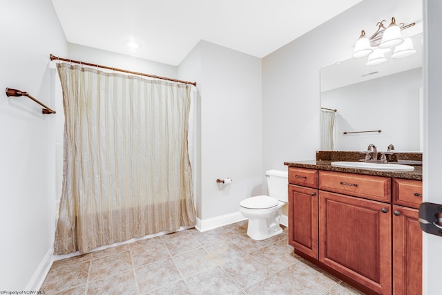 full bathroom featuring tile patterned floors, toilet, vanity, and shower / bath combo with shower curtain