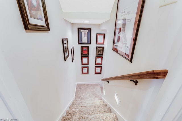 stairway with carpet flooring