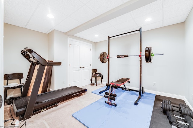 workout area with a paneled ceiling