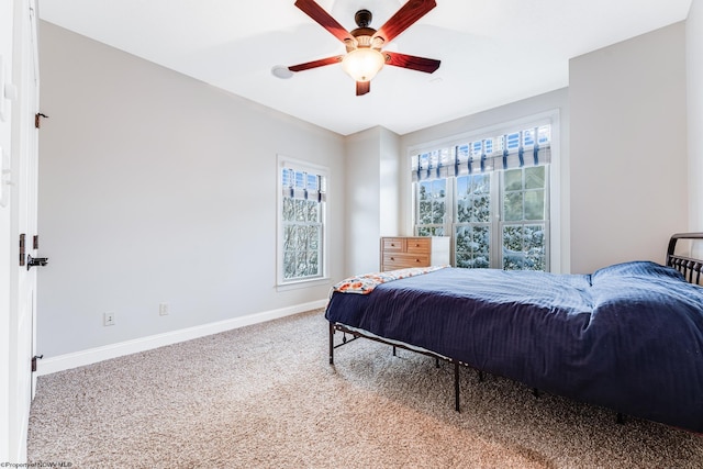 bedroom featuring ceiling fan and carpet floors