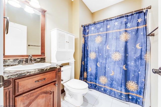 bathroom featuring tile patterned floors, vanity, and toilet