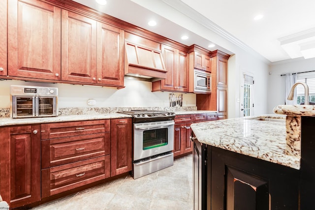 kitchen with appliances with stainless steel finishes, light stone counters, custom range hood, crown molding, and sink