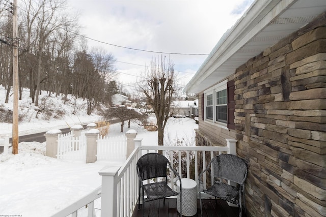 view of snow covered deck