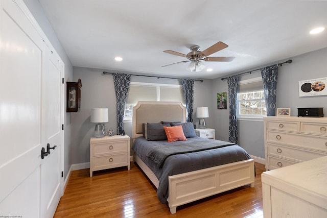 bedroom featuring wood-type flooring and ceiling fan