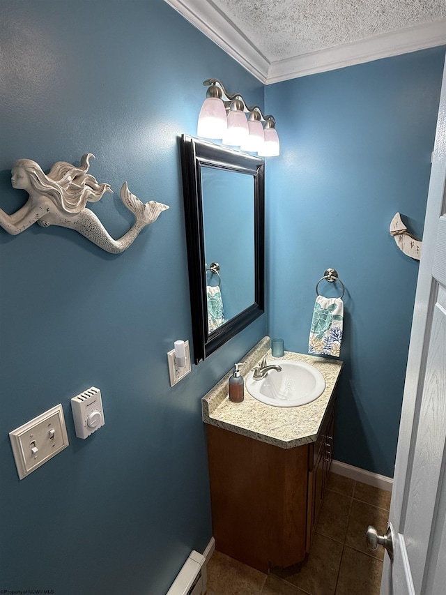 bathroom featuring tile patterned flooring, ornamental molding, vanity, and a textured ceiling