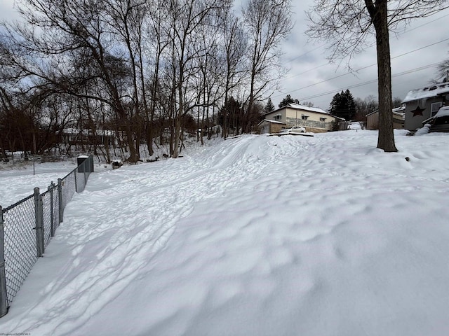 view of yard layered in snow