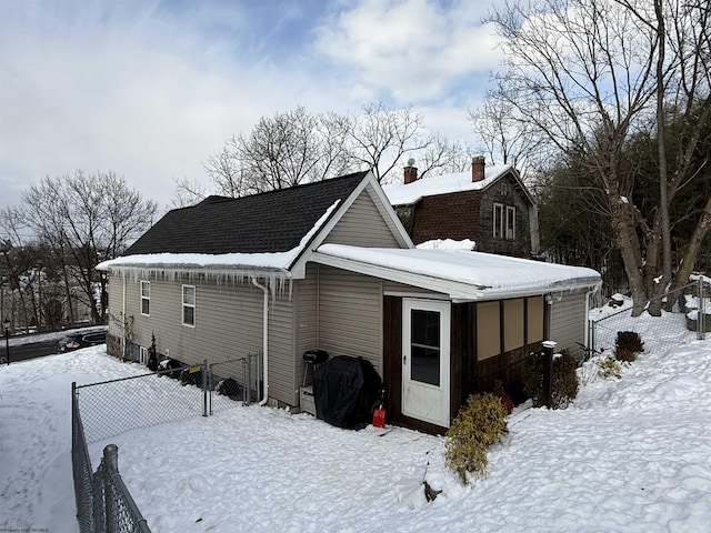 view of snow covered house