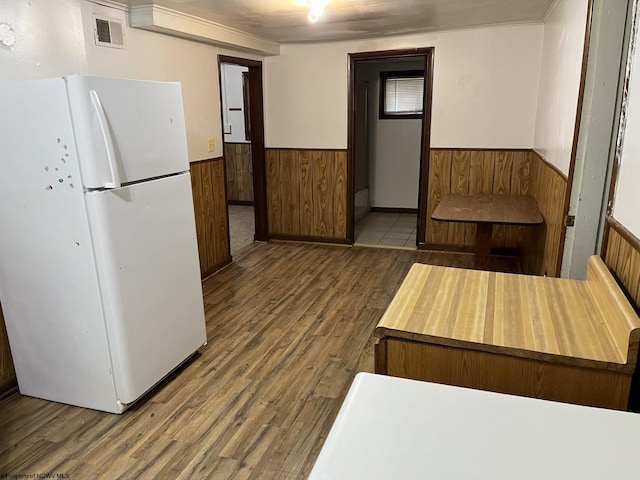 kitchen with dark hardwood / wood-style floors and white refrigerator