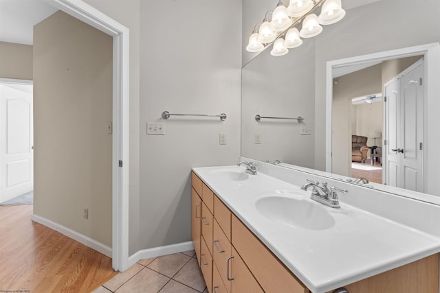 bathroom with tile patterned flooring and vanity