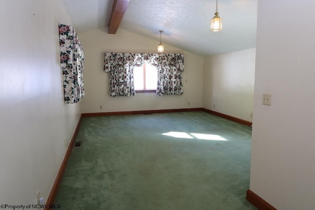 spare room featuring a textured ceiling, carpet, and vaulted ceiling with beams