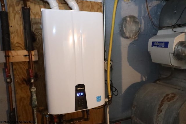 utility room with tankless water heater