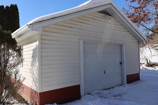 view of snow covered garage