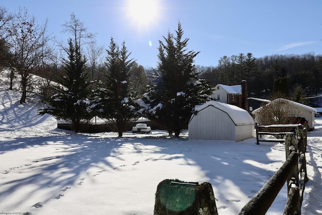 view of yard layered in snow