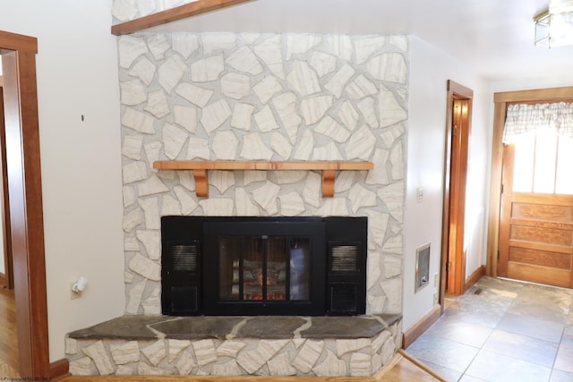 details with a stone fireplace