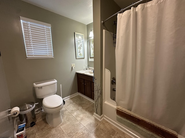 full bathroom with vanity, shower / tub combo, and toilet