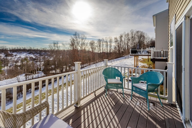 view of snow covered deck