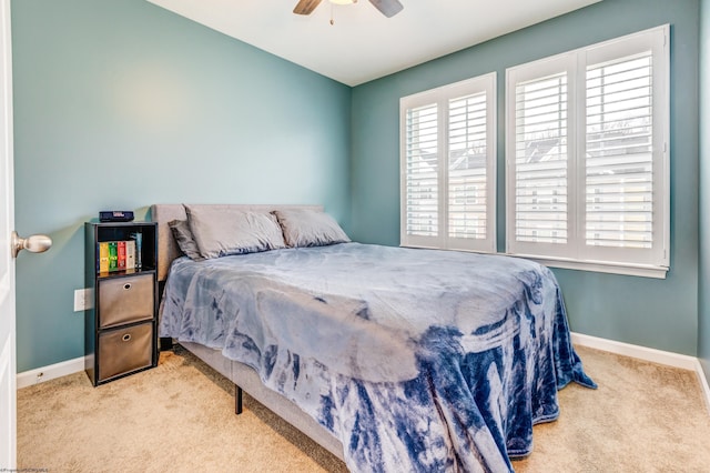 bedroom with light carpet and ceiling fan