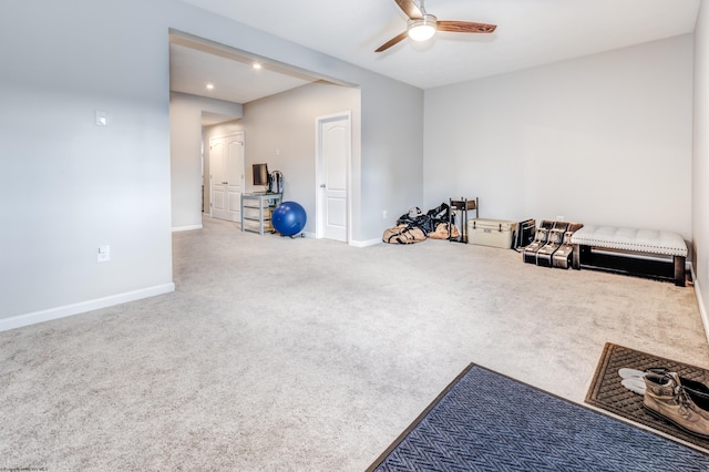 misc room with carpet floors and ceiling fan