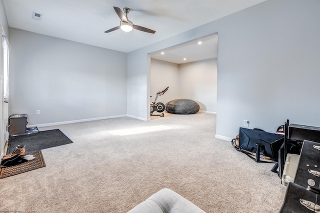 interior space featuring carpet and ceiling fan