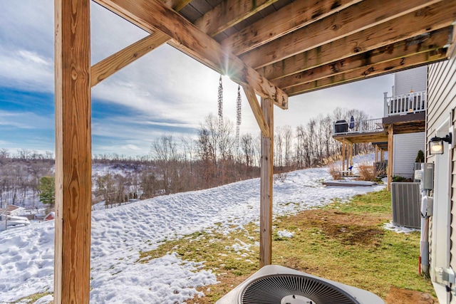 yard layered in snow with cooling unit