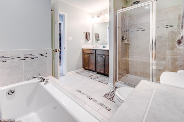 bathroom featuring tile patterned floors, vanity, toilet, and a shower with door