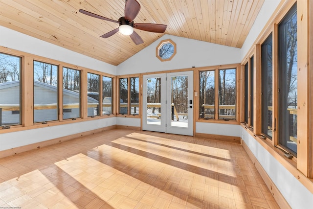 unfurnished sunroom featuring lofted ceiling, a wealth of natural light, wooden ceiling, and ceiling fan