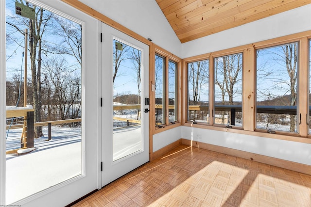 unfurnished sunroom featuring wood ceiling and lofted ceiling