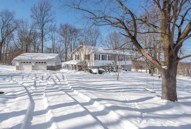 view of front of property featuring an outbuilding and a garage