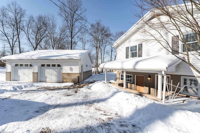 view of front of property with a garage and a porch